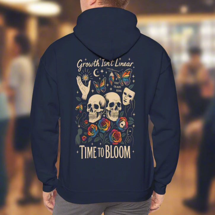 Growth Isn't Linear hoodie featuring skulls, roses, and butterflies design with 'Time to Bloom' message.