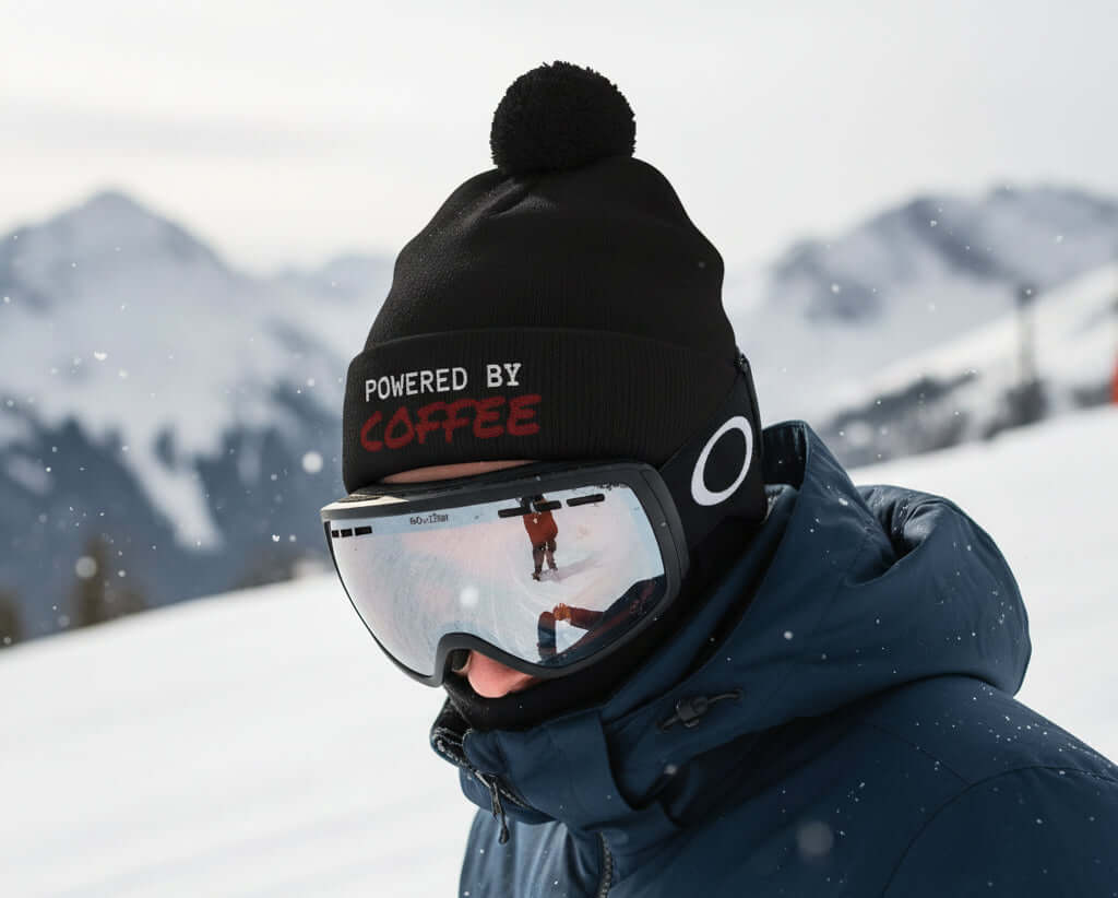 woolly hat for skiing, funny saying, powered by coffee, black bobble hat