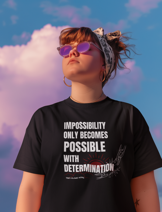 Premium Black T Shirt with an empowering determination slogan and symbolic artwork representing breaking barriers and personal growth.