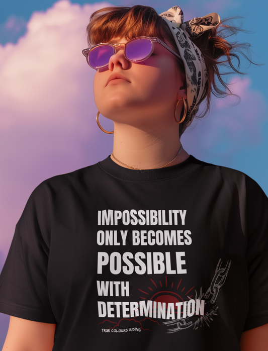 Premium Black T Shirt with an empowering determination slogan and symbolic artwork representing breaking barriers and personal growth.