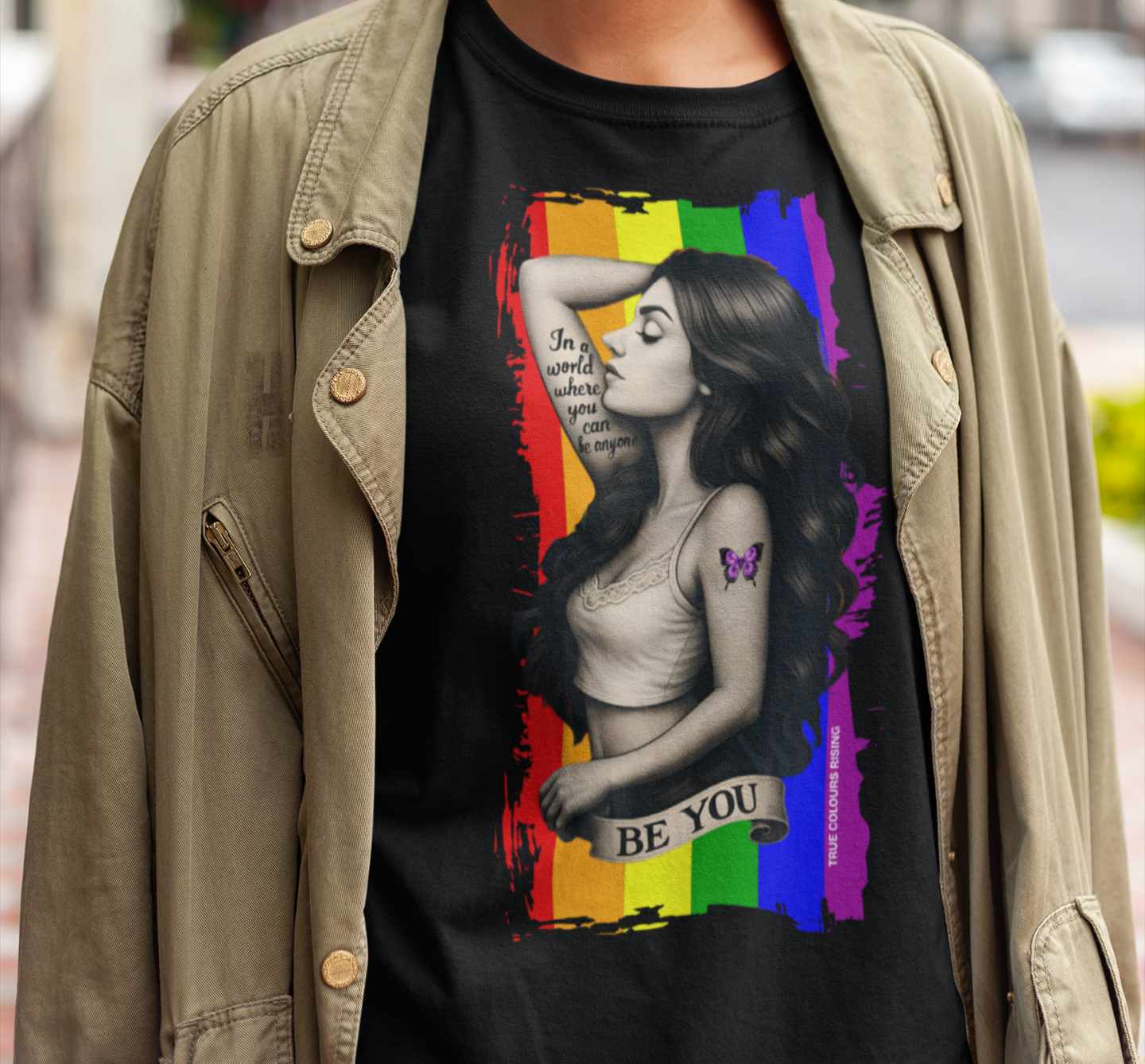 Be You pride t-shirt featuring rainbow flag background and empowerment tattoo-style artwork