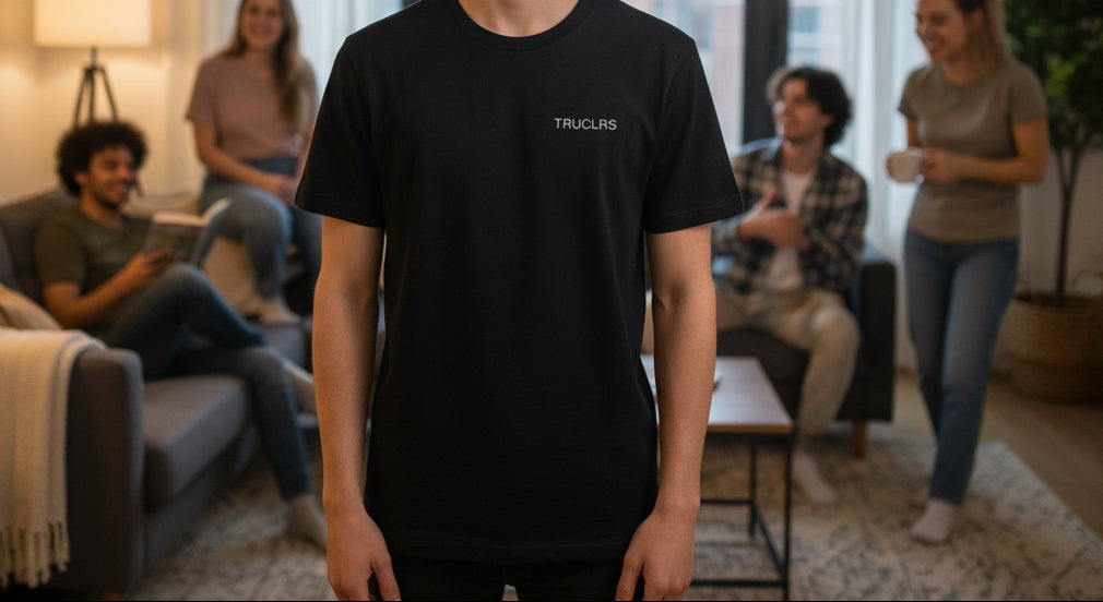 Black t-shirt with 'TRUCLAS' logo on a white background
