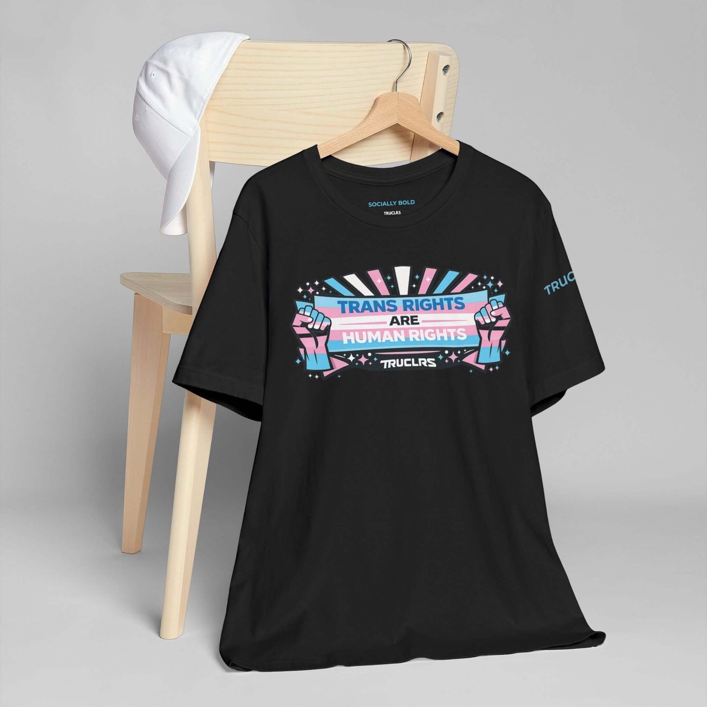 Modern streetwear t shirt featuring transgender pride banner and solidarity fists