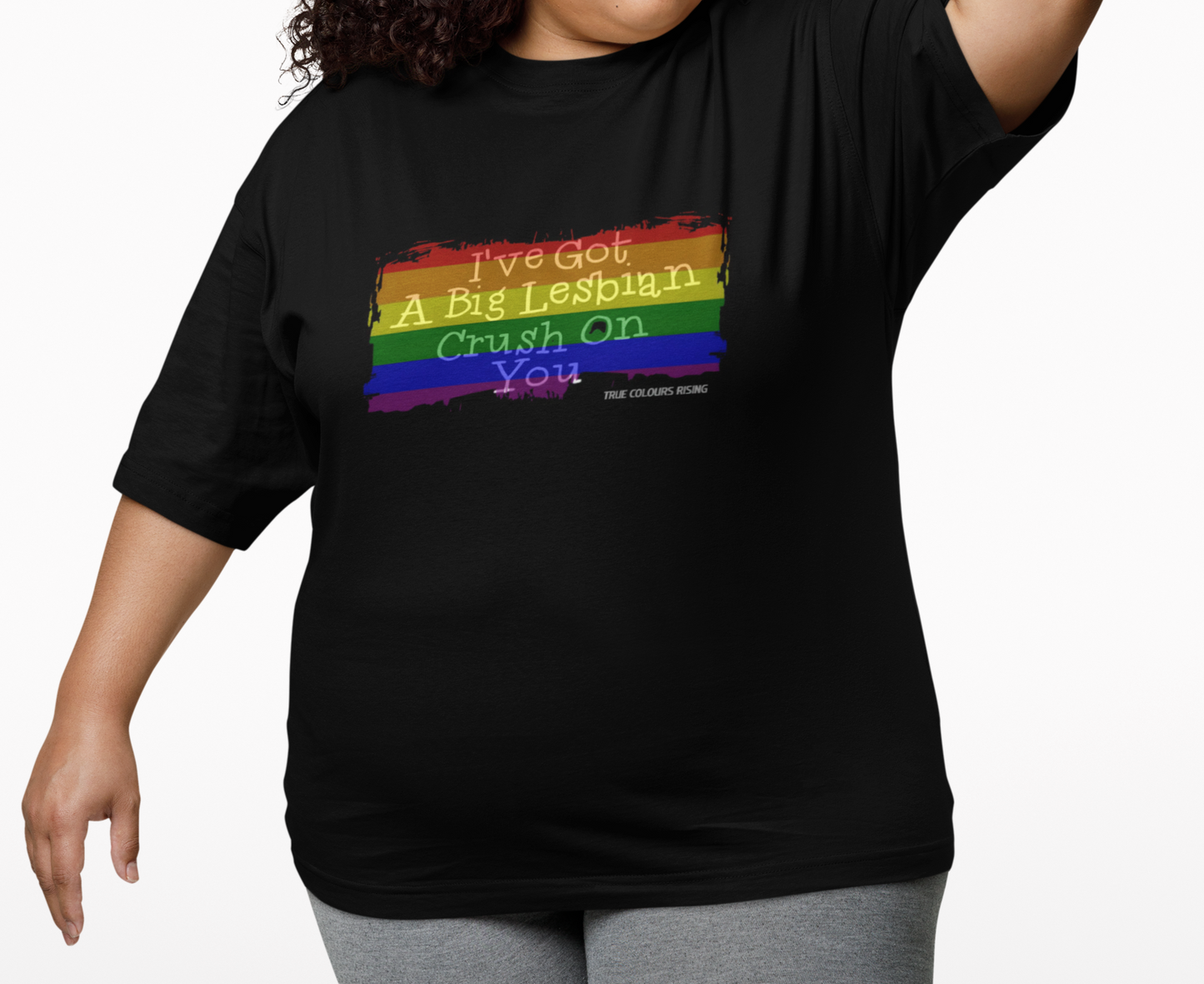 Close-up of bold rainbow flag graphic with “Big Lesbian Crush” text on black t-shir