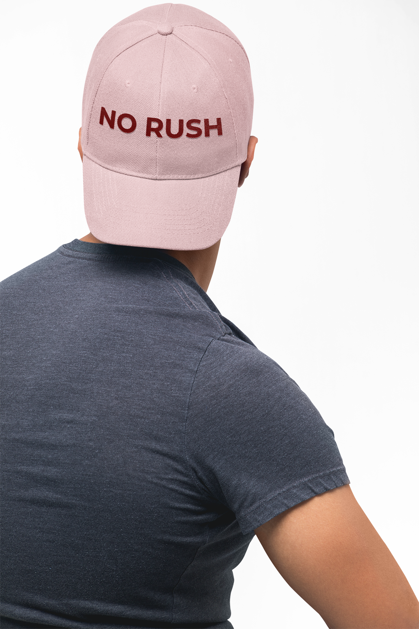 Soft pink relaxed cap showcasing minimalist NO RUSH branding