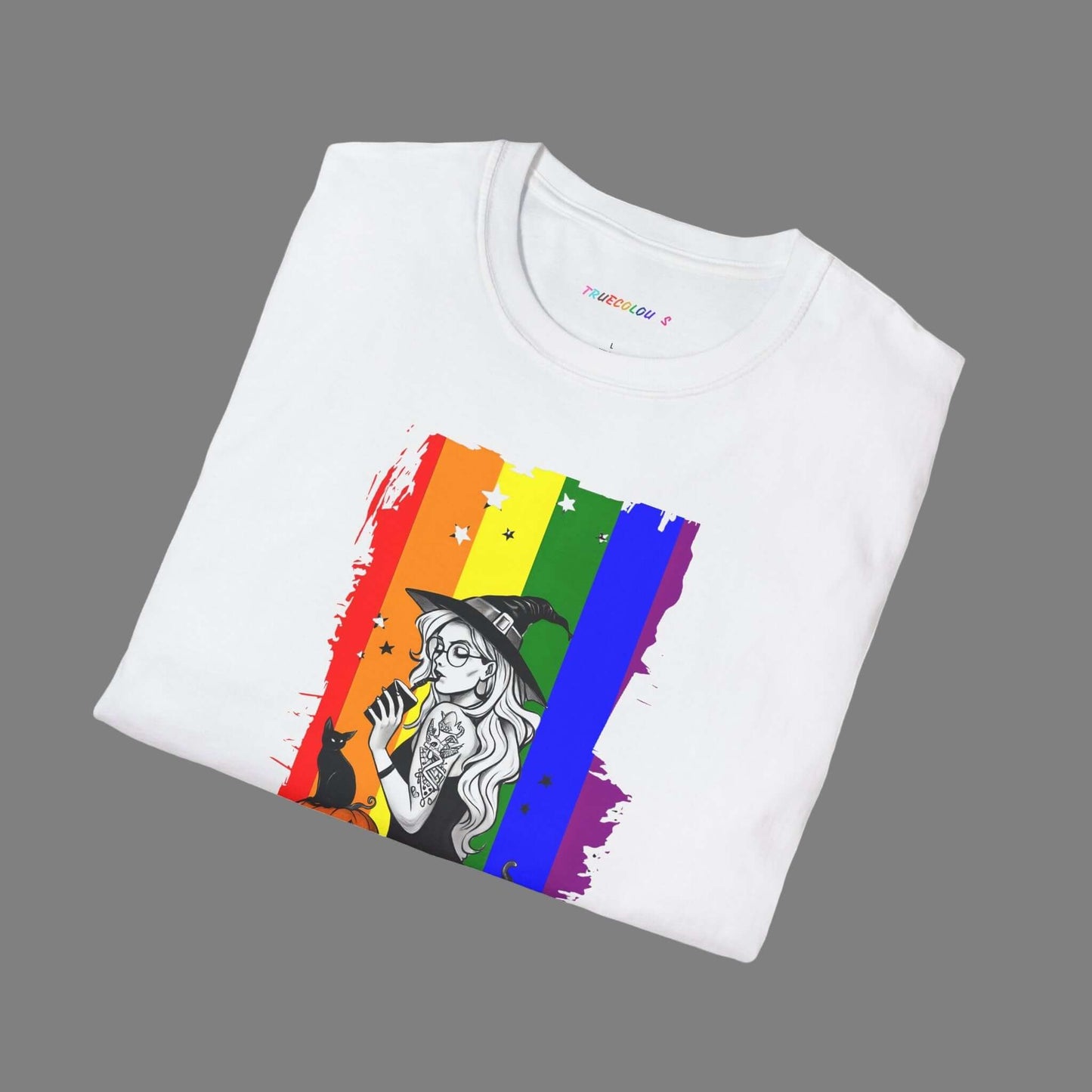 True Colours Rising Logo Witchy Pride Halloween T-shirt featuring a witch, rainbow flag background, pumpkins, and a black cat.