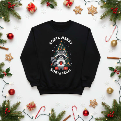 Sorta Merry Sorta Feral Christmas Jumper featuring a raccoon design, festive decorations, and a cozy black background.