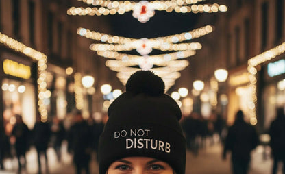 Stylish black winter bobble hat with embroidered slogan