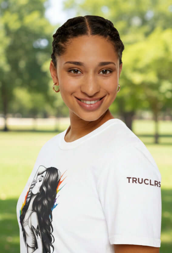 Model wearing Be You - Reimagined T-shirt with bold illustration and vibrant colors in a park setting.