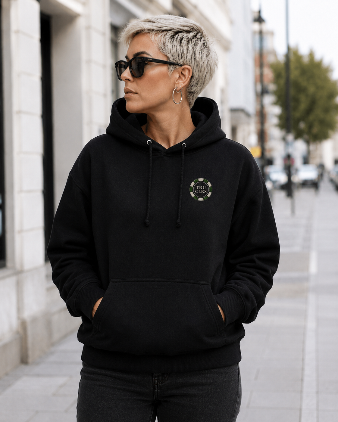 Lucky Shot black hoodie front featuring a small TRU CLRS poker chip logo on the left chest with premium heavyweight streetwear styling.