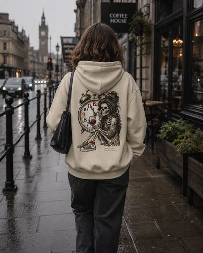 Alternative streetwear hoodie featuring a skeleton holding a glass of wine beside a colourful vintage clock.