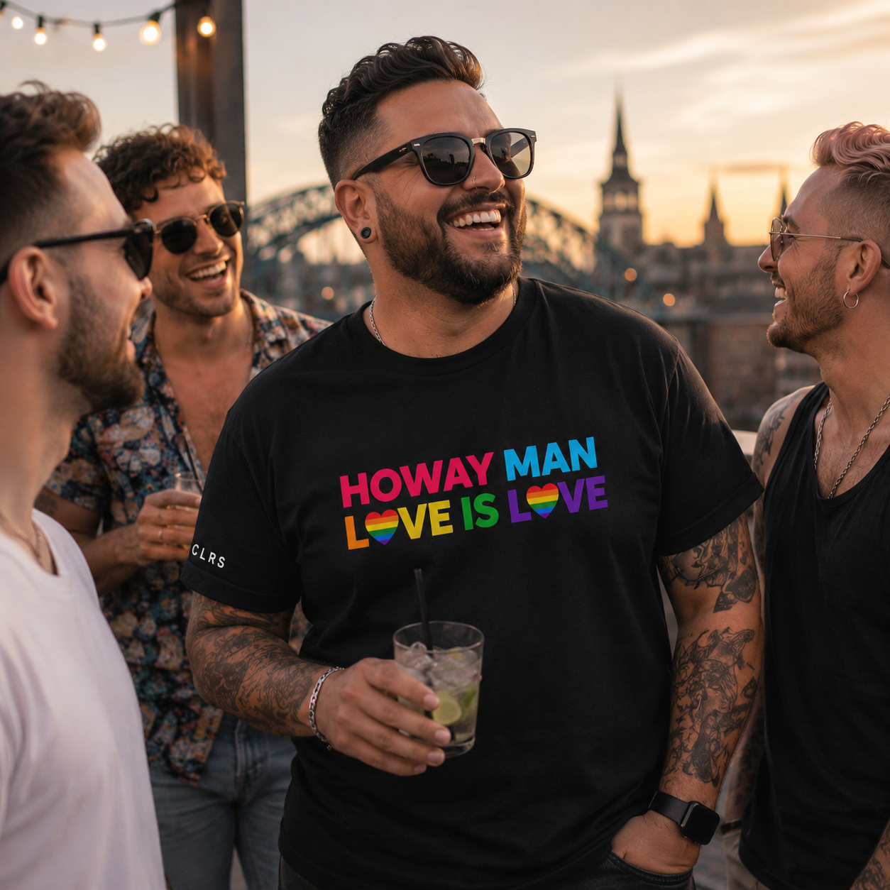 True Colours Rising Pride collection featuring HOWAY MAN Love Is Love and Unapologetically Me graphic T-shirts.