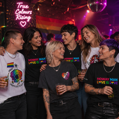 Group of lesbian women celebrating Pride in a nightclub wearing TRUCLRS Pride T-shirts with rainbow designs and inclusive messages.