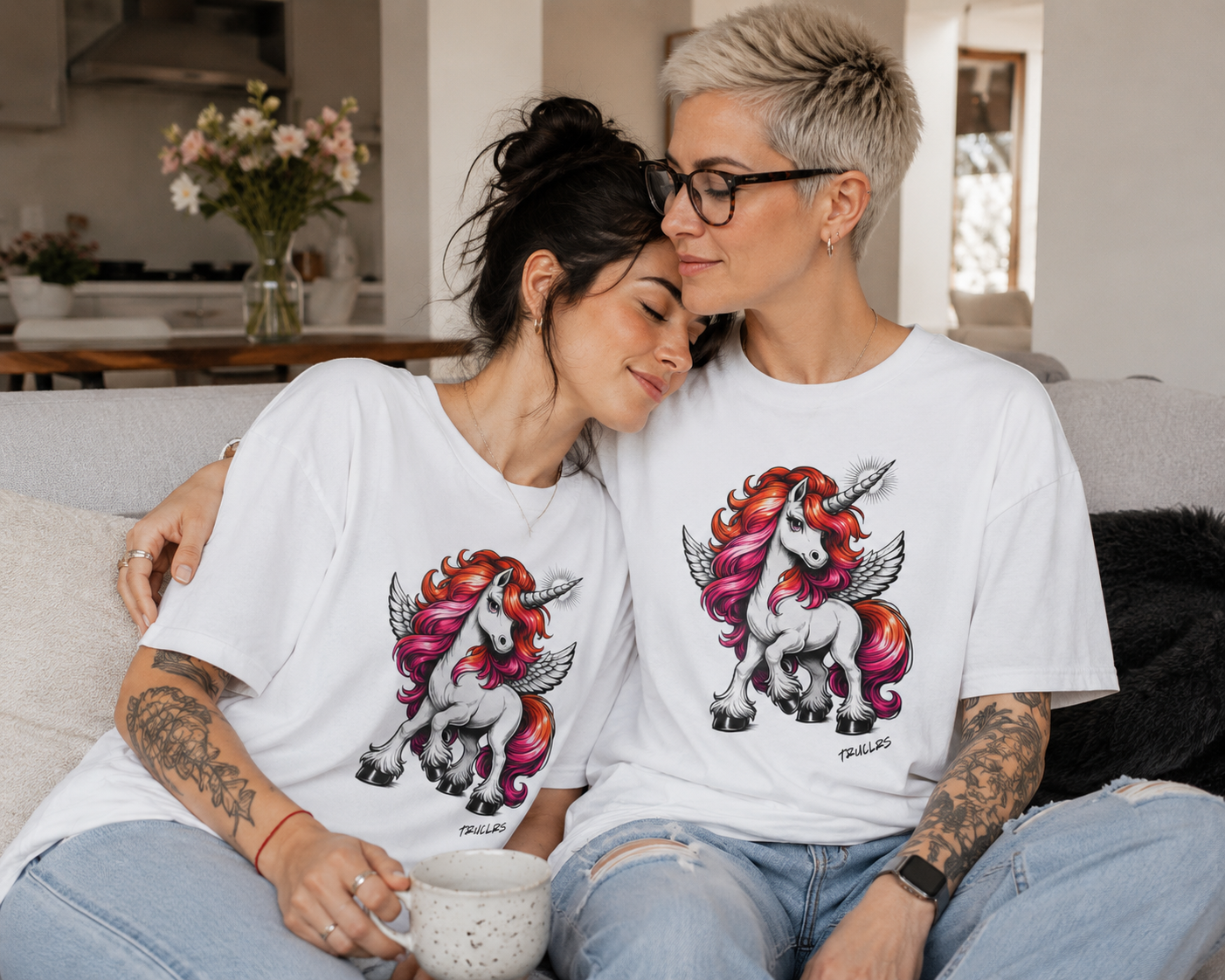 Premium recycled cotton pride t shirt featuring winged unicorn design in lesbian pride colours