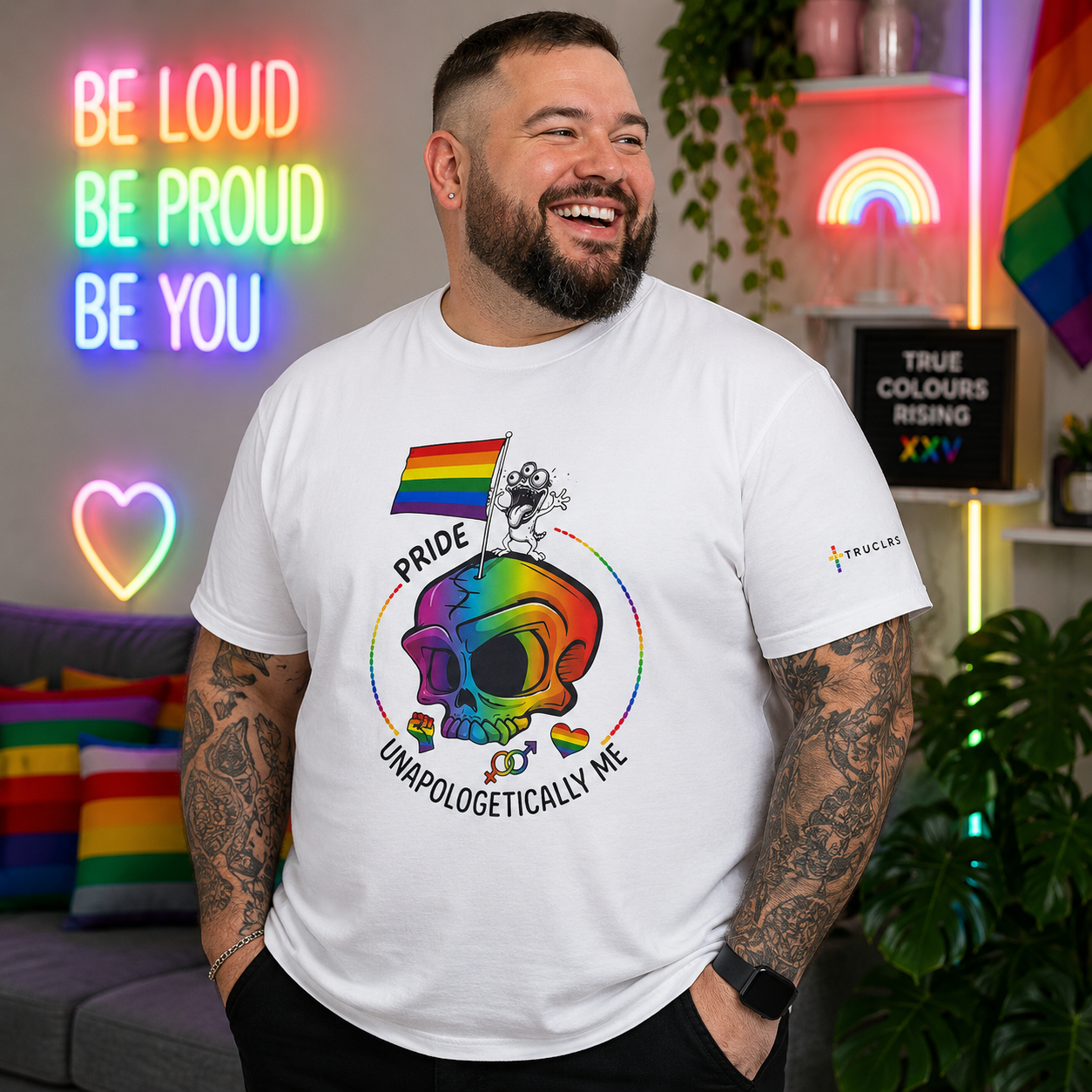 White LGBTQ+ pride T-shirt with rainbow skull design and Unapologetically Me slogan, created for self-expression and visibility.