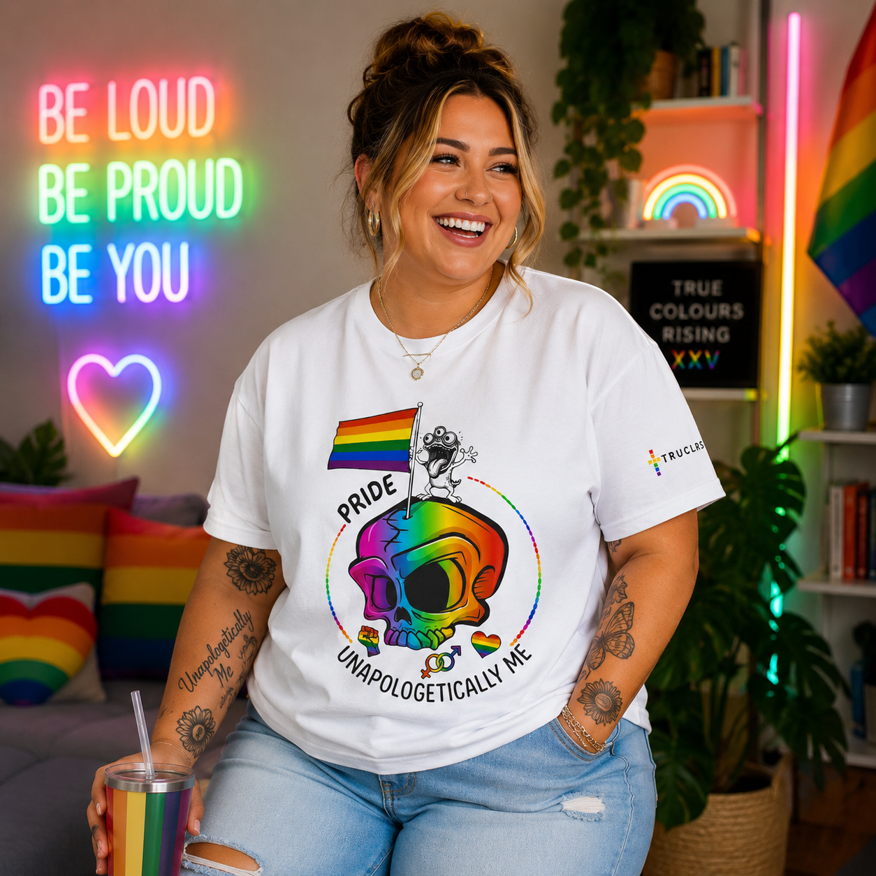 Unapologetically Me LGBTQ+ pride T-shirt featuring a vibrant rainbow skull, pride flag and inclusive community symbols on a white recycled cotton tee.