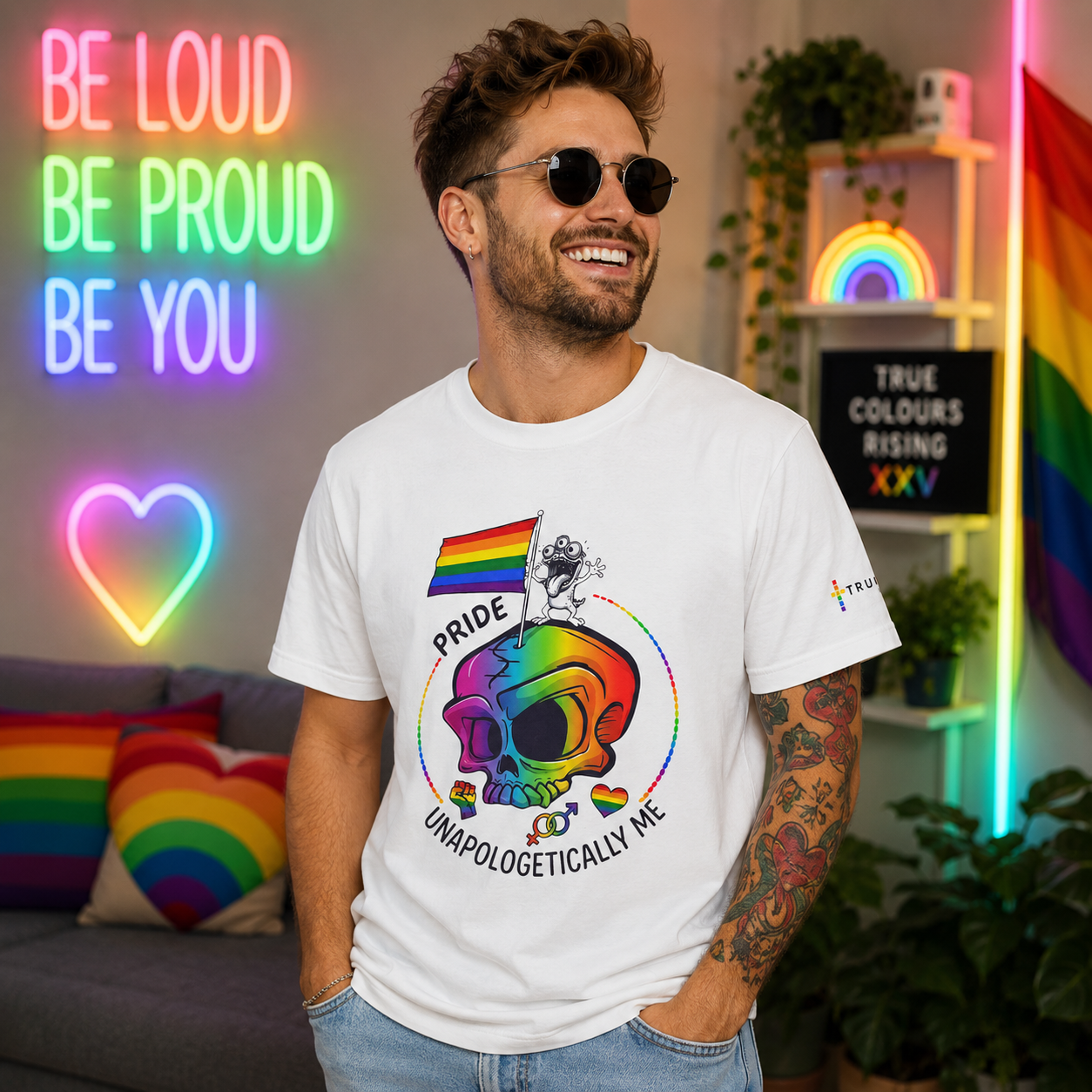 Front view of the Unapologetically Me tee featuring a colourful rainbow skull illustration surrounded by pride-inspired artwork