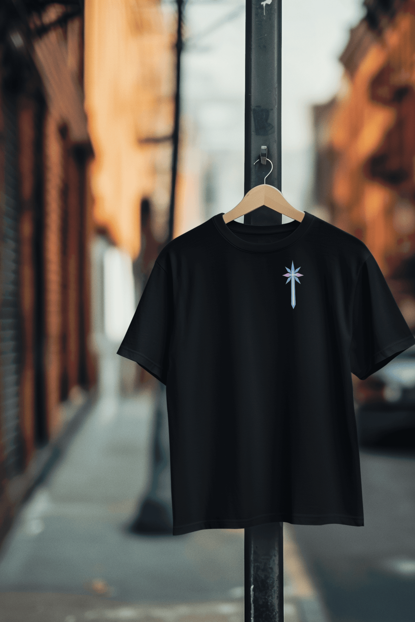 Black t-shirt with a discreet symbolic blade graphic over the chest