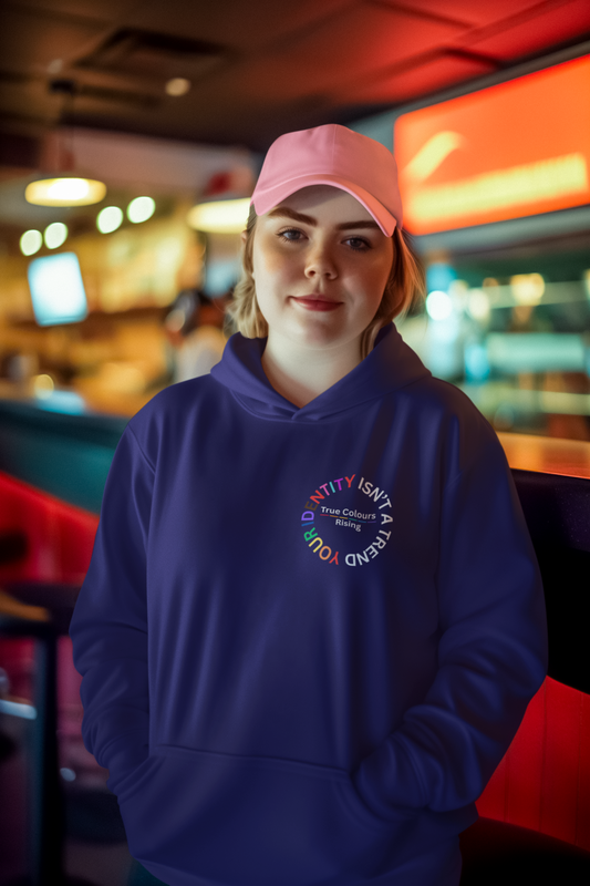 pink cap, navy hoodie. Words of empowerment, identity is not a trend, it's a revolution.  True Colours Rising
