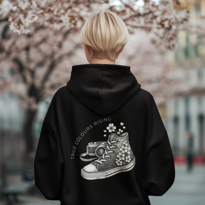 Urban black hoodie with symbolic sneaker camera and floral design