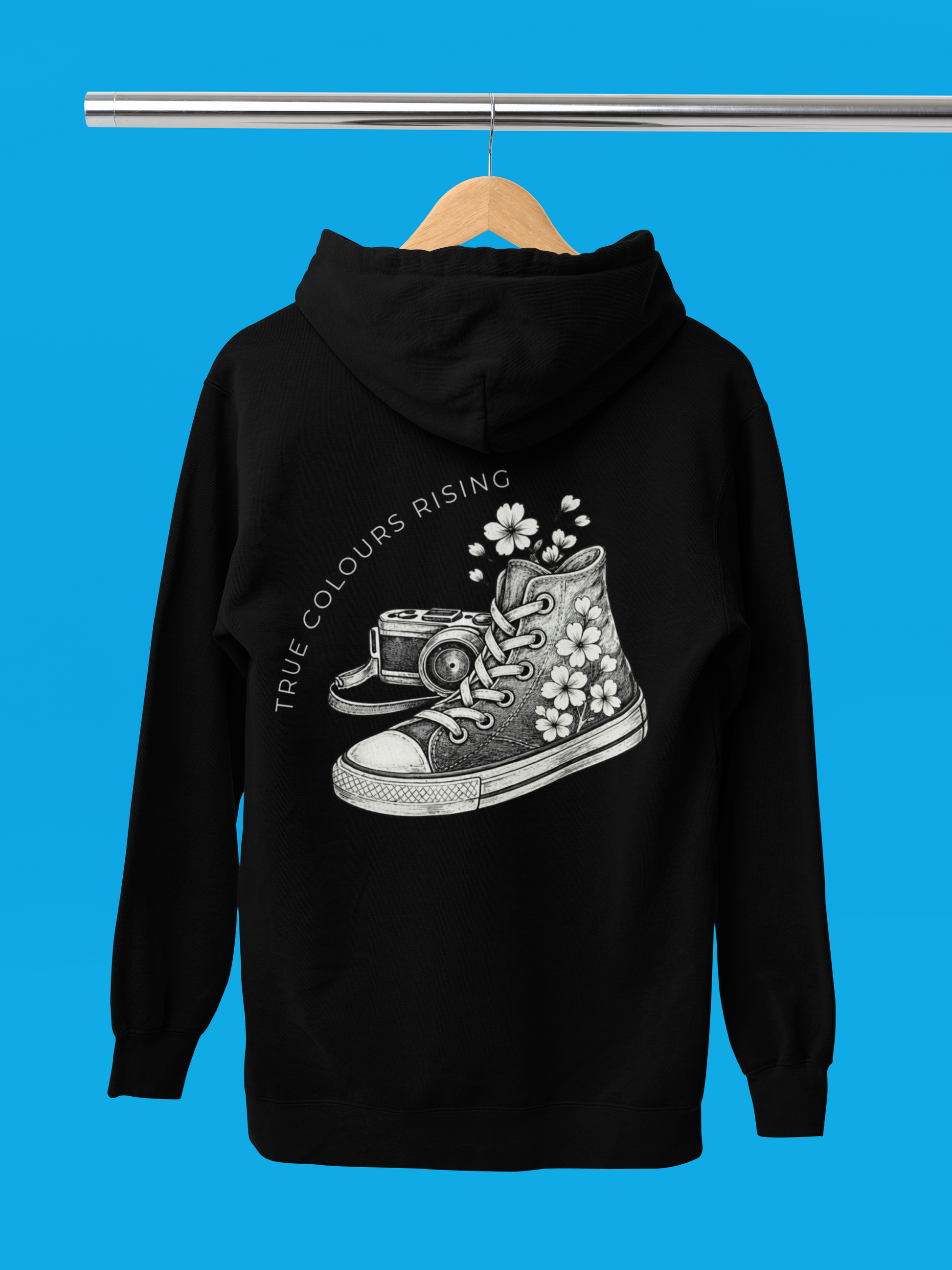 Black hoodie with a graphic design of a sneaker and flowers on a blue background