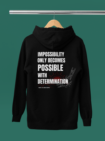 Streetwear hoodie with “Impossibility only becomes possible with determination” text design