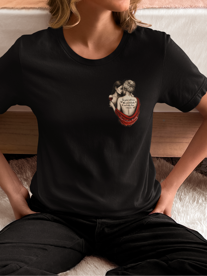 Artistic photo of a woman in a black t-shirt with a tattoo-style graphic of a queer femme couple on the front