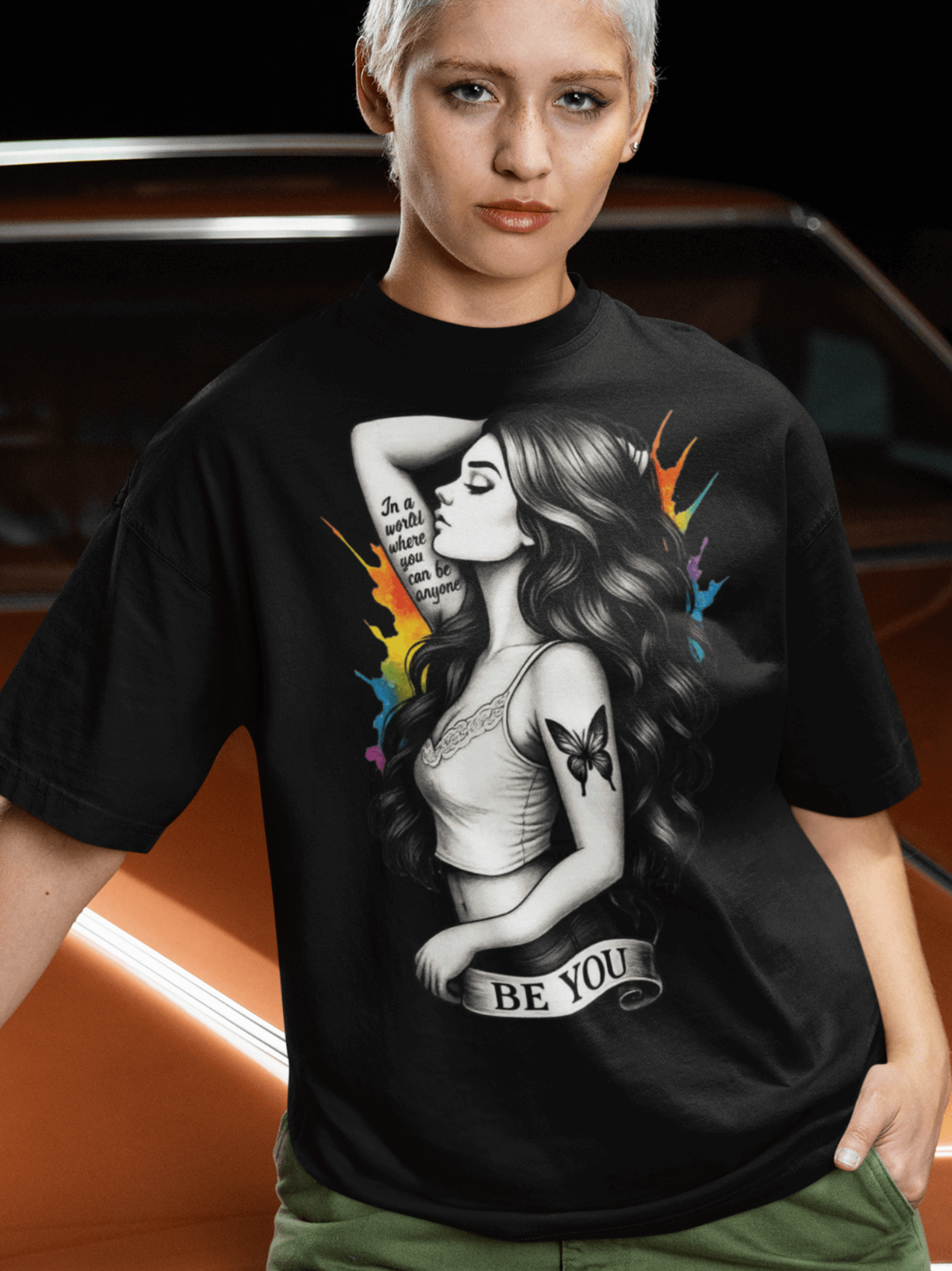 Model wearing a Be You - Reimagined T-shirt featuring a bold illustration of individuality.