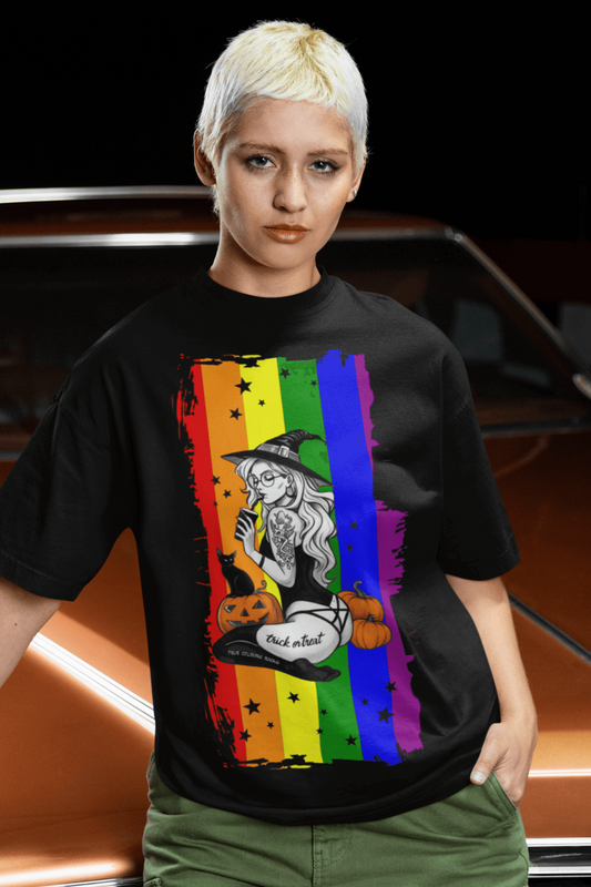 Witchy Pride Halloween T-shirt featuring a rainbow flag design with a magical witch and pumpkins.