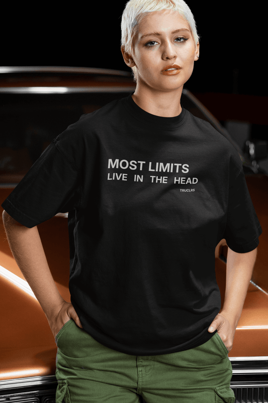 Black minimalist t-shirt with “Most Limits Live in the Head” text on chest