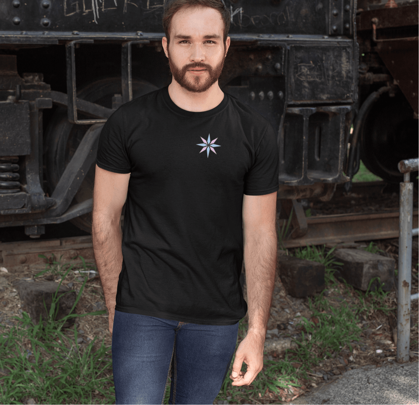 Minimalist black tee featuring a subtle trans pride asterisk star design