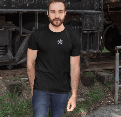 Minimalist black tee featuring a subtle trans pride asterisk star design