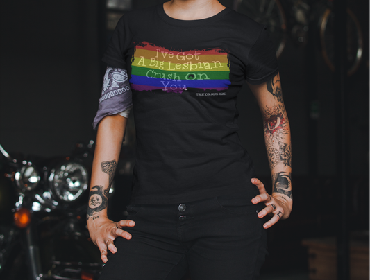Close-up of rainbow flag graphic and Big Lesbian Crush’ text on black t-shirt