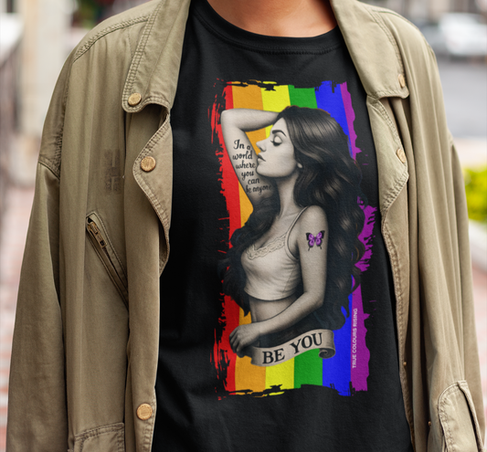 Be You pride t-shirt featuring rainbow flag background and empowerment tattoo-style artwork